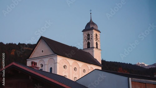 Time lapse 24h church with clouds & sun - Laax, Switzerland - Graded