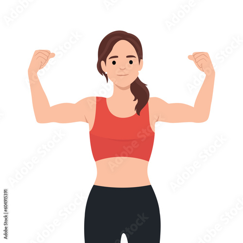 Beautiful young strong powerful woman showing her muscles