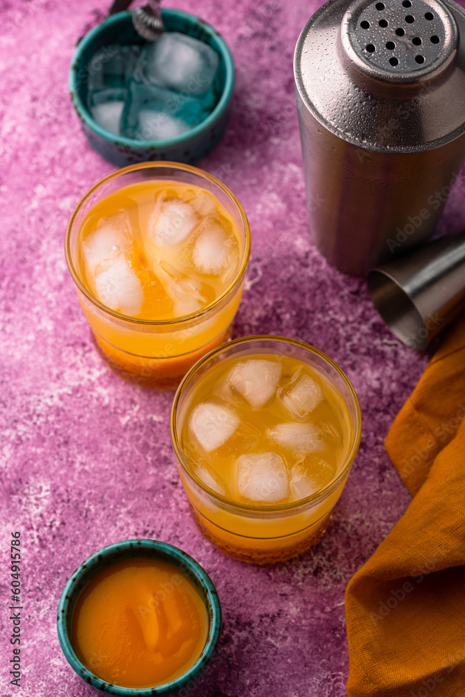 Summer cocktail with mango juice and ice Summer cocktail with mango juice and ice