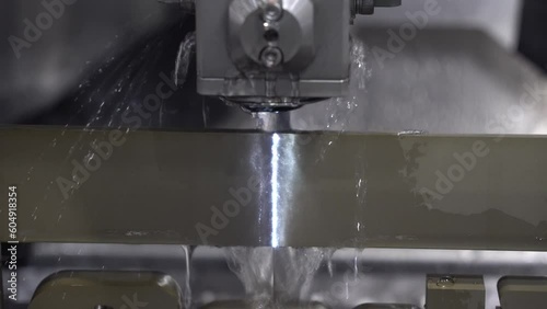 Closeup scene the wire EDM machine cutting the mold insert parts.