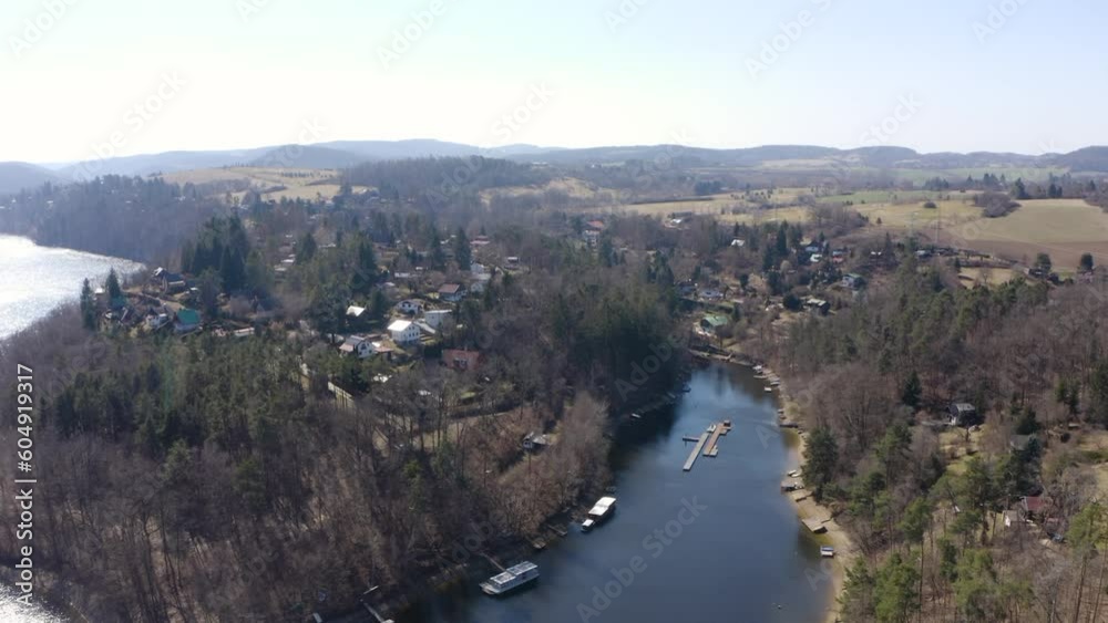 Aerial view from a drone - a small town in a wooded rural area - drone drifts forward Aerial view from a drone - a small town in a wooded rural area - drone drifts forward