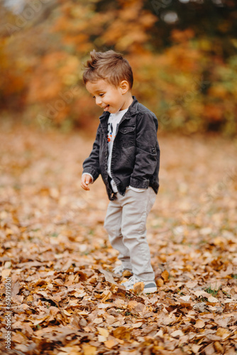 Child in the forest smiling and playing