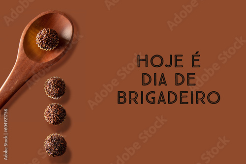 Brigadeiro (Brigadeiro) Traditional Brazilian sweet. Chocolate sweets on dark background written in portuguese 