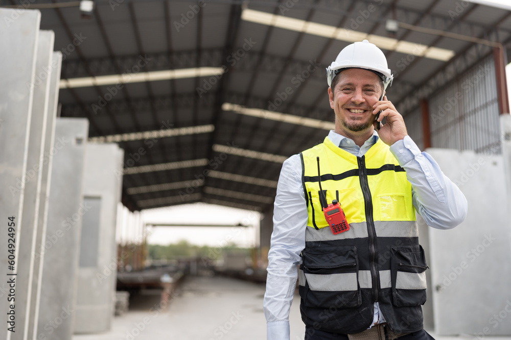 Portrait happy caucasian engineer man working at precast site work Portrait happy caucasian engineer man working at precast site work
