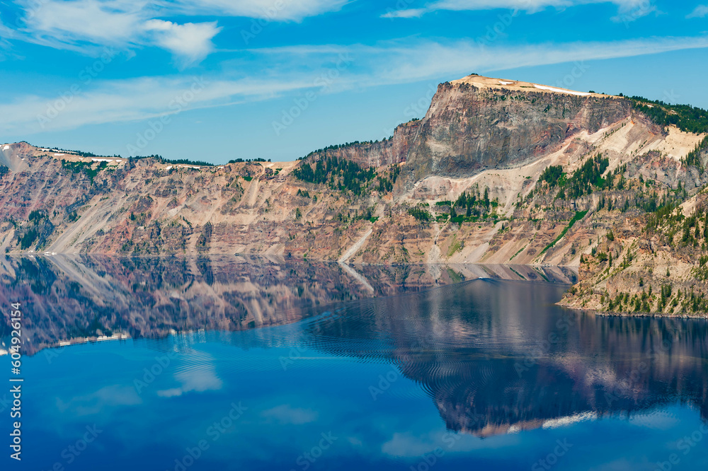 Scenic view of Crater lake with reflections of the mountains, Oregon, USA