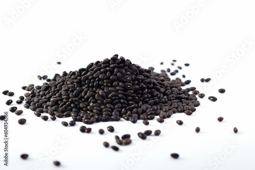 Black beans (Urad dal black gram vigna mungo) flying in the air isolated on white background,
