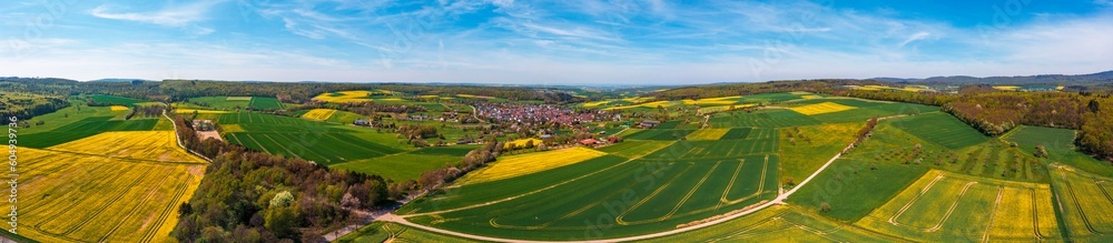 Panoramic aerial view of the Taunus landscape with flowering rapeseed fields near Wallrabenstein - Germany