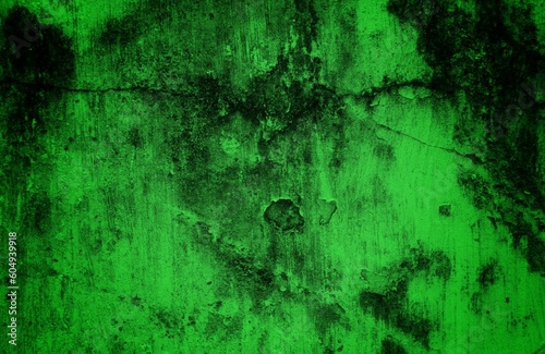 A dark and textured pattern of old, dirt-covered green backgrounds with an abstract effect.