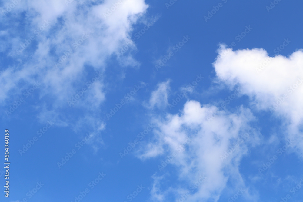 Blue sky with white clouds in the daytime background. Blue sky with white clouds in the daytime background.