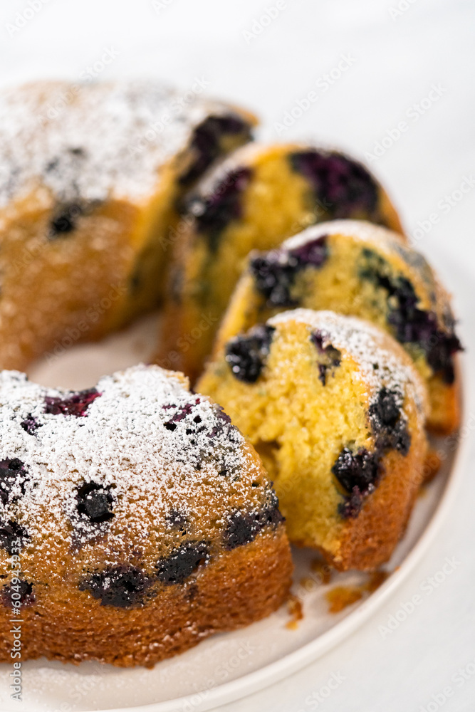 Lemon blueberry bundt cake with powdered sugar dusting