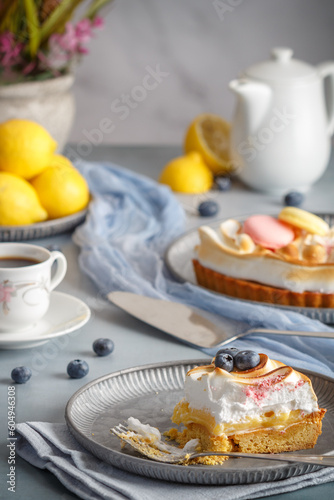 Lemon meringue pie with blueberries. Close up. Copy space