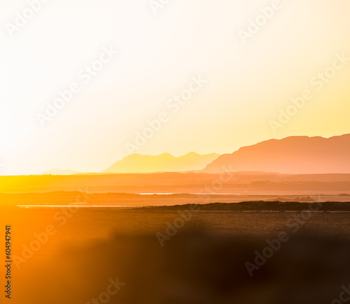 Majestic Sunset: A Captivating Orange Landscape with Distant Mountains in Iceland