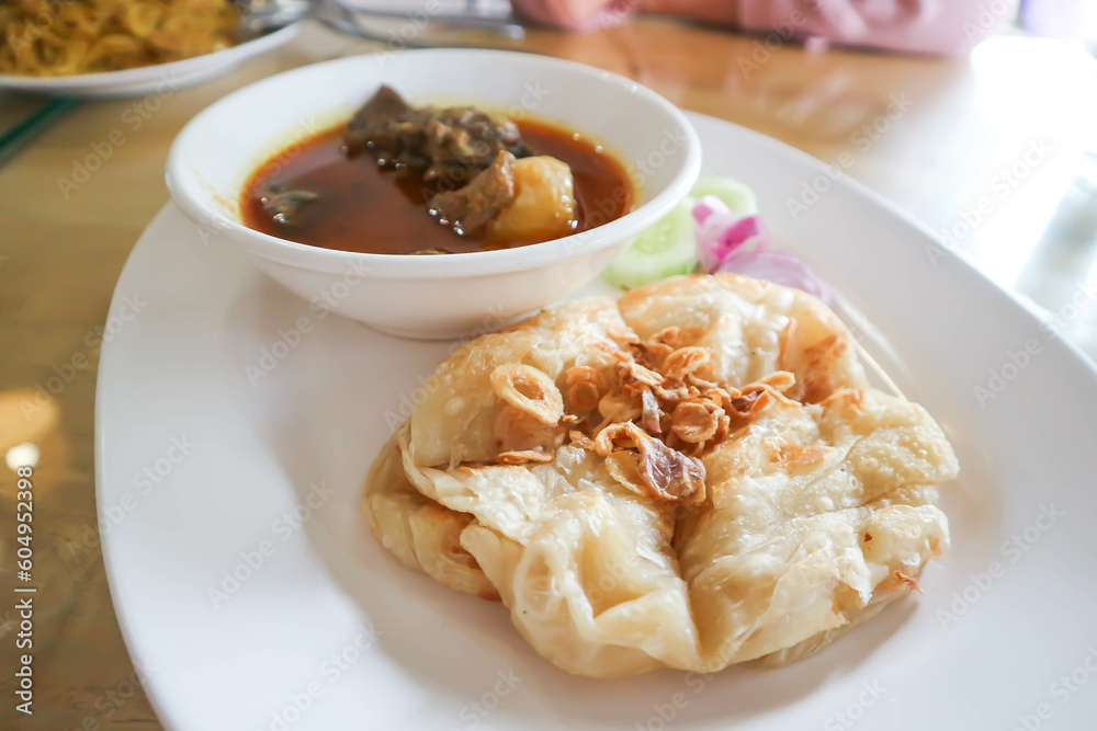 naan bread or roti with curry soup or beef stewed naan bread or roti with curry soup or beef stewed