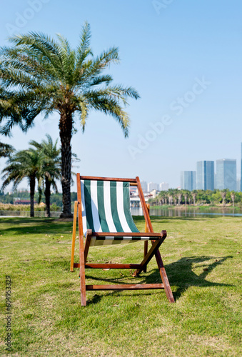 Deck chair in the park © xy