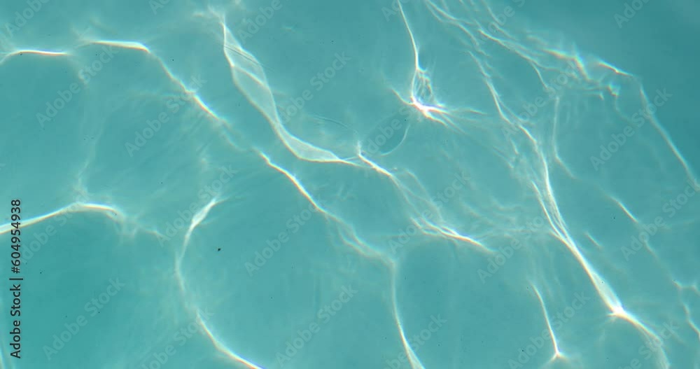 Pool ripples in summer sun light reflection
