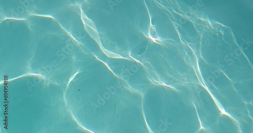 Pool ripples in summer sun light reflection
