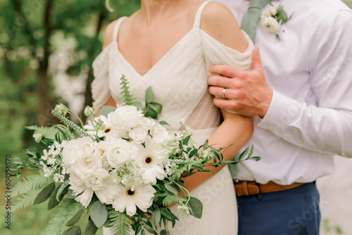 Bride in wedding dress holding a bouquet