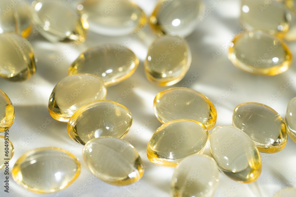 Fish Oil Omega 3 on white background, vitamin D yellow supplement gel capsules, macro shot
Fish Oil Omega 3 on white background, vitamin D yellow supplement gel capsules, macro shot