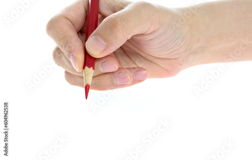 Woman hand holding pencil on white background