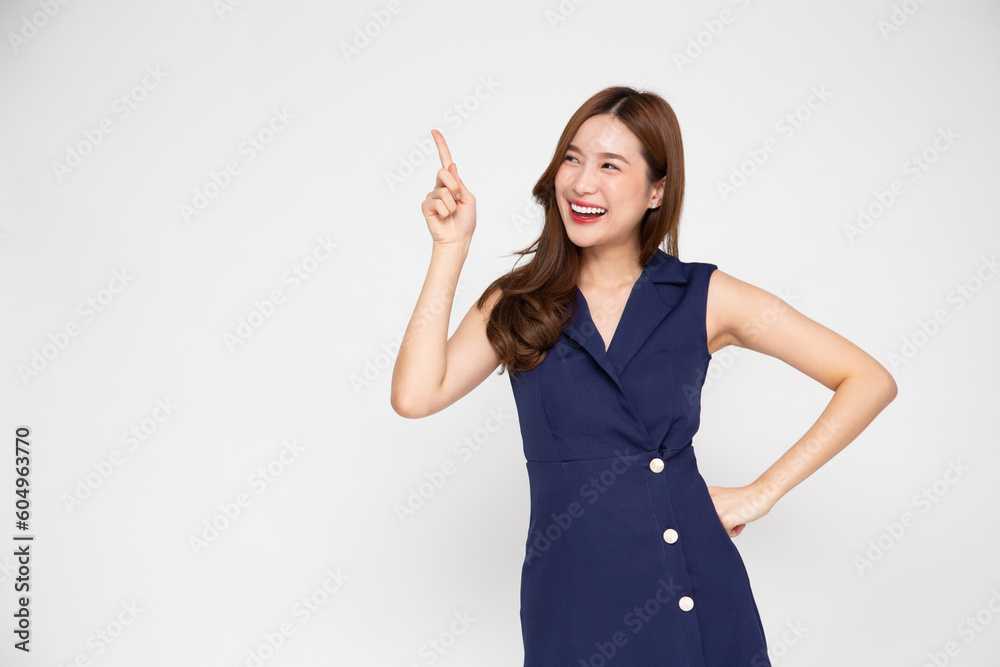 Young Asian business woman pointing to empty copy space isolated on white background Young Asian business woman pointing to empty copy space isolated on white background