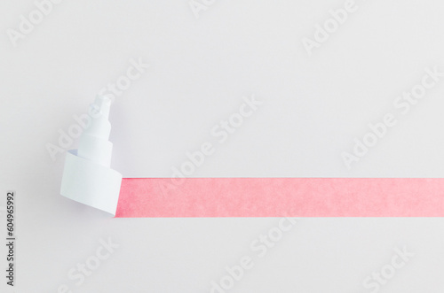 White torn paper on pink background
