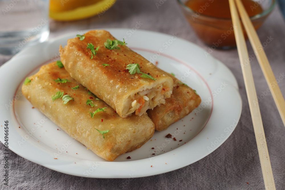 Spring rolls - a typical dish in Chinese and other Southeast Asian cuisines Spring rolls - a typical dish in Chinese and other Southeast Asian cuisines