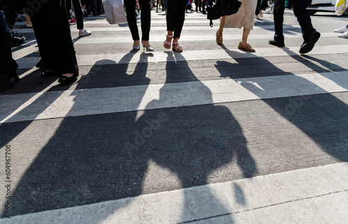Shadows of people on the crosswalk