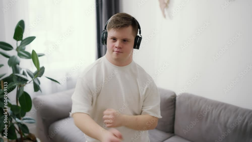 Funny guy with down syndrome dancing at home, feel total freedom Funny guy with down syndrome dancing at home, feel total freedom