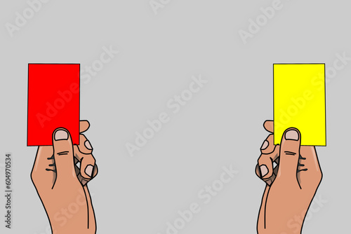 The hand of the football (soccer) referee giving a red and yellow card. Warning and exclusion of the player due to a serious offense and unsportsmanlike conduct	