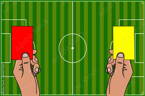 The hand of the football (soccer) referee giving a red and yellow card. Warning and exclusion of the player due to a serious offense and unsportsmanlike conduct	