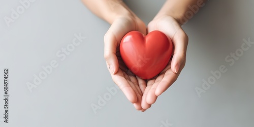 Young women hands holding red heart,health care, donate and family insurance concept,world heart day, world health day, CSR responsibility, adoption foster family, hope, gratitude, kind, generative ai