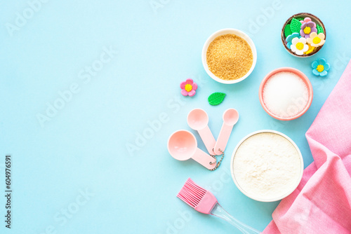 Food baking background. Ingredients for cooking at blue. Flat lay.