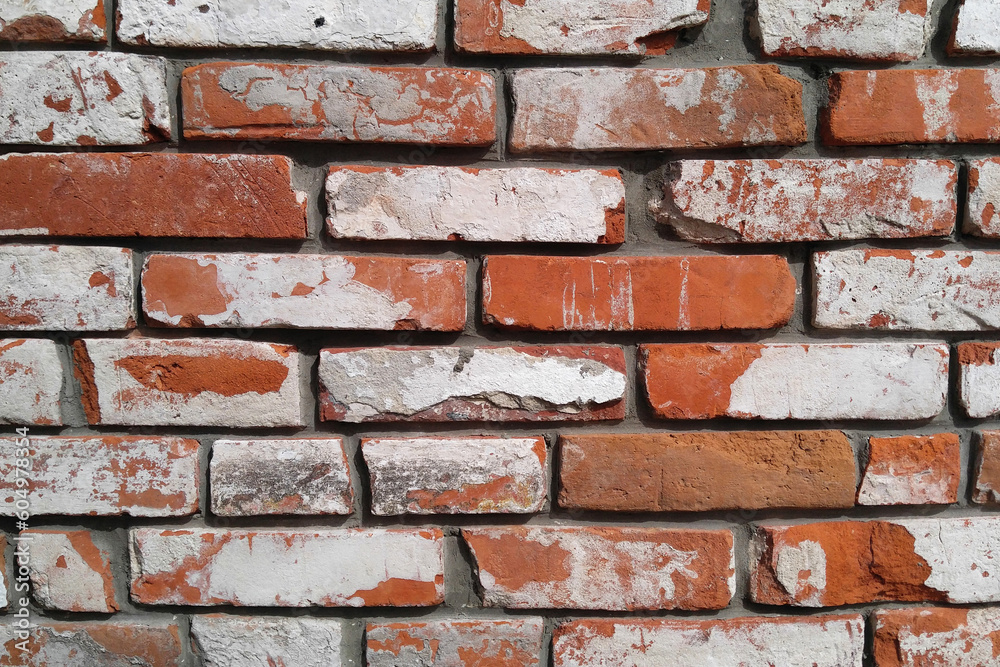 Brick dilapidated wall masonry of red bricks with white coating Brick dilapidated wall masonry of red bricks with white coating