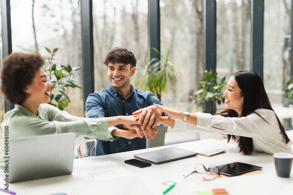 Business Team Holding Hands Uniting On Corporate Mission In Office Business Team Holding Hands Uniting On Corporate Mission In Office