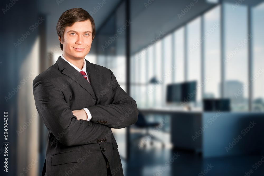Portrait of the successful young male businessman in office building Portrait of the successful young male businessman in office building
