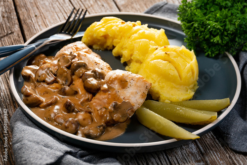 Grilled chicken breast with mushroom sauce.