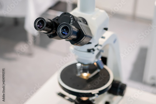 Professional medical microscope in science lab, exhibition. Medicine, technology, laboratory concept © zyabich