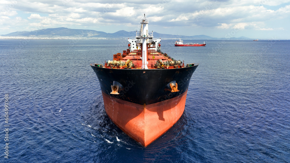 Aerial drone photo of huge bulk carrier tanker anchored in deep blue Aegean sea