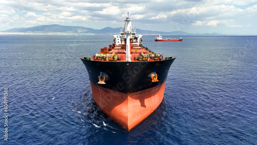 Obraz na płótnie Aerial drone photo of huge bulk carrier tanker anchored in deep blue Aegean sea w salonie