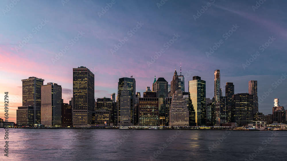 Skyline of lower Manhattan during the twilight seen from Brooklyn Bridge Park, New York