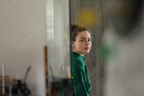 Portrait of young woman in an office. photo
