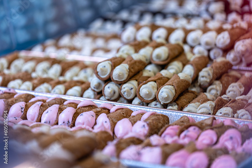 Multiple types of cannoli on trays