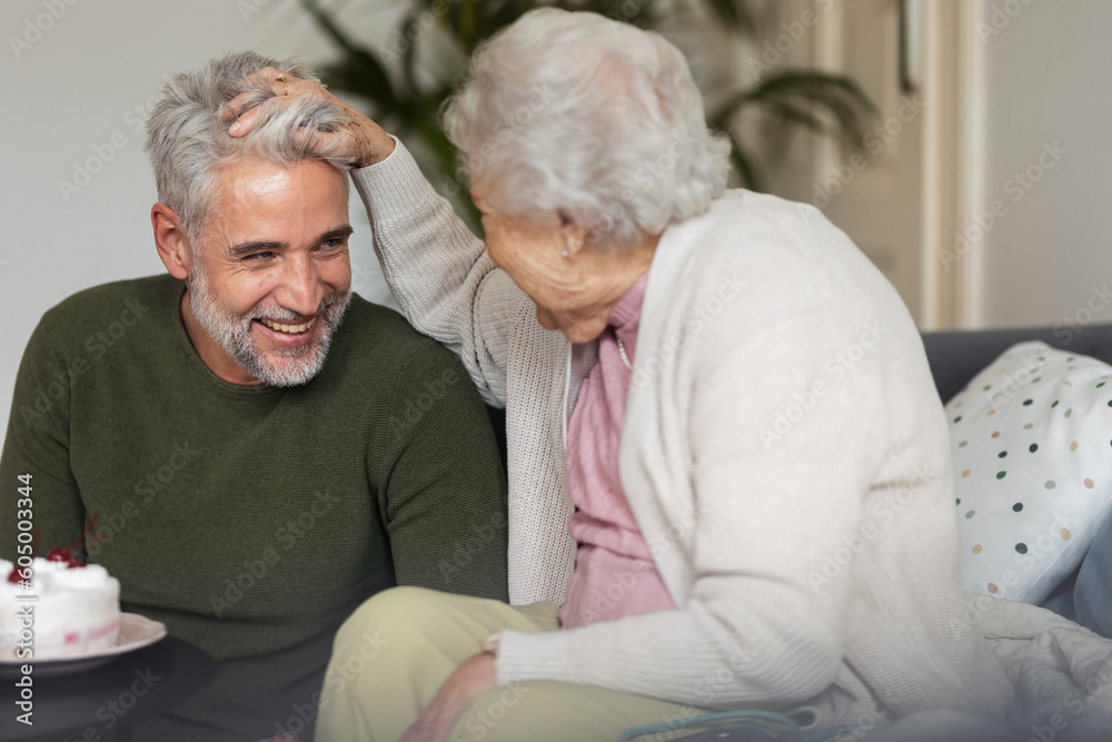 Adult man and senior woman spending quality time together. Adult man and senior woman spending quality time together.