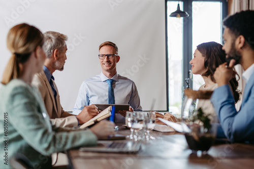 Young colleagues having meeting in the office.