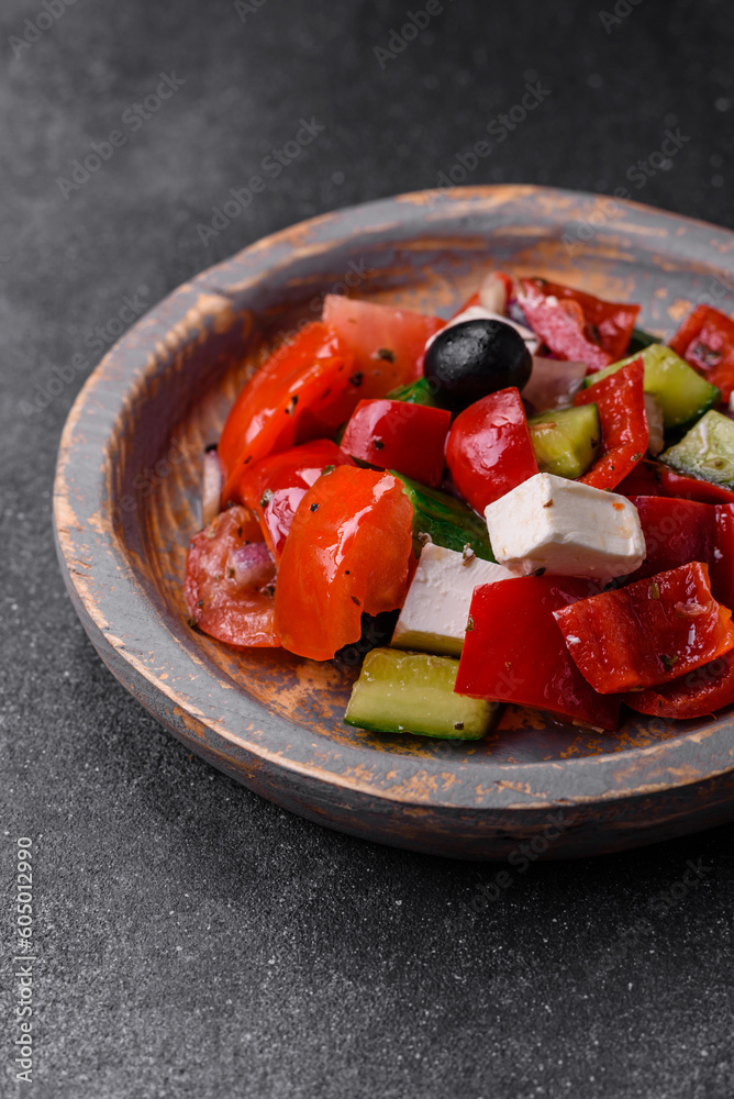 Delicious fresh juicy greek salad with feta cheese, olives, peppers and tomatoes