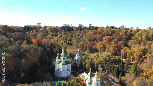 Aerial view of the Vydubychi Monastery, at sunset, Kyiv, Ukraine, Kyiv botanical garden. Vydubitsky Saint Michael monastery, Arial drone View of church in the botanical garden in Kyiv, capital  photo