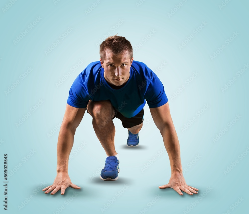 Sporty sprinter young man on the running track. Sporty sprinter young man on the running track.