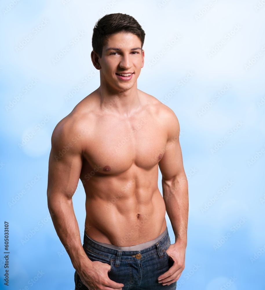 Handsome young sporty guy posing in studio.