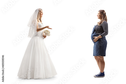 Full length profile shot of a bride talking to a pregnant woman