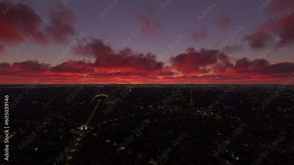 Aerial shot at night of Paris with the Eiffel Tower and the Arc de Triomphe in the background. France
